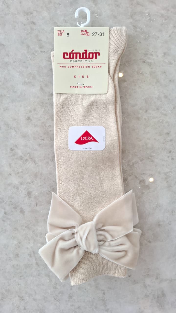 Calcetines altos punto liso con lazo de terciopelo