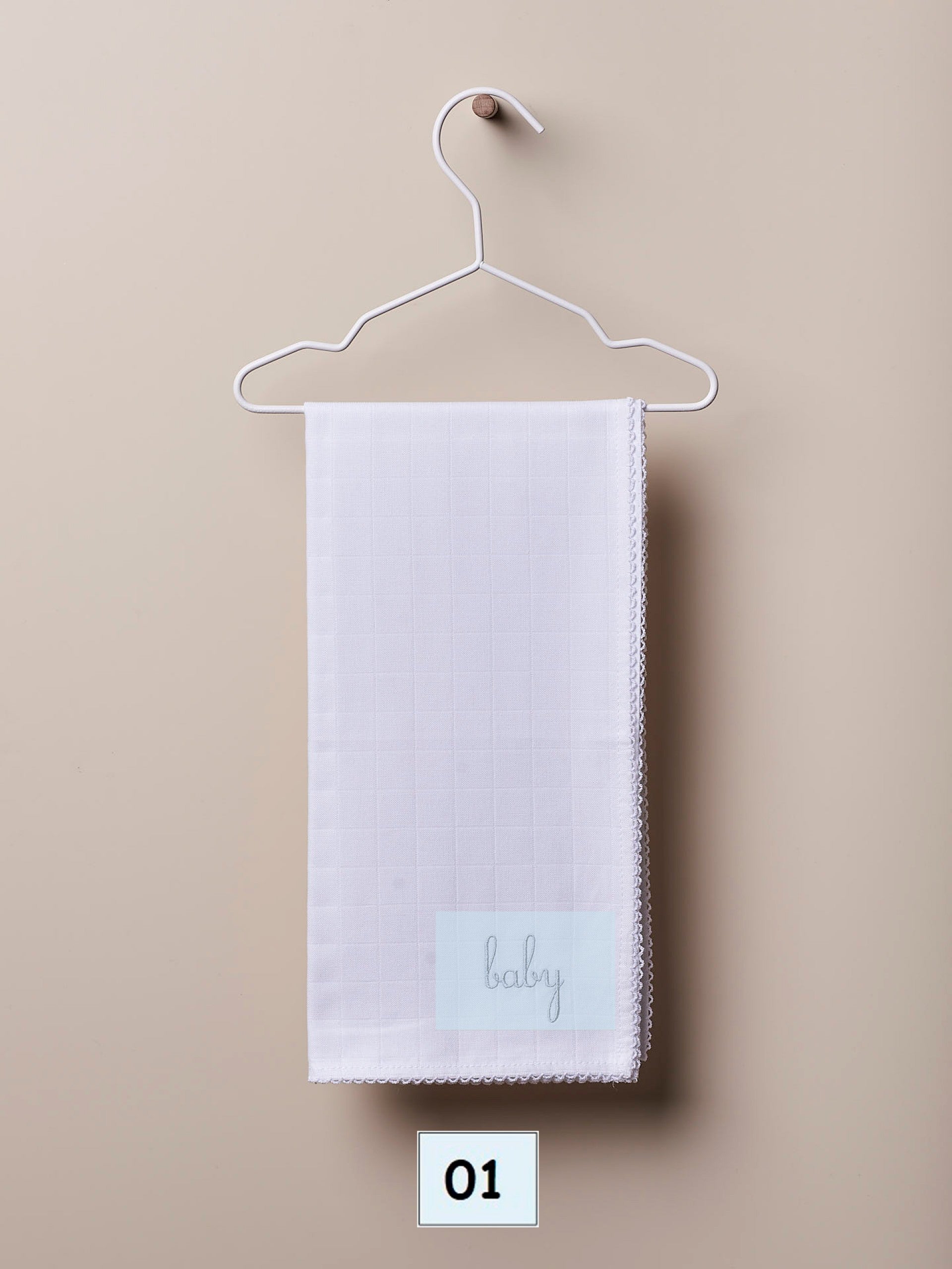 Cotton swaddle with the word “baby”